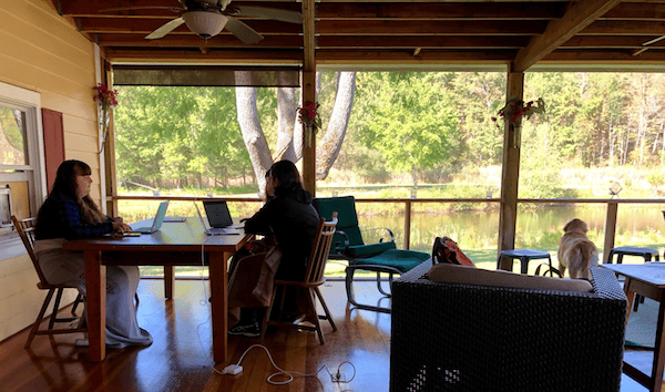 An image of the Olark team working at a table. Once you&rsquo;ve started capturing live chats in your CRM, sit with your sales team and determine what your workflows are going to be.