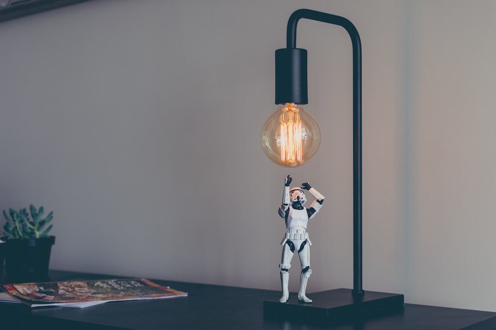 An image of a Storm Trooper figurine and a light. Artificial intelligence - “chatbots” - can help shed light on customer sentiment.