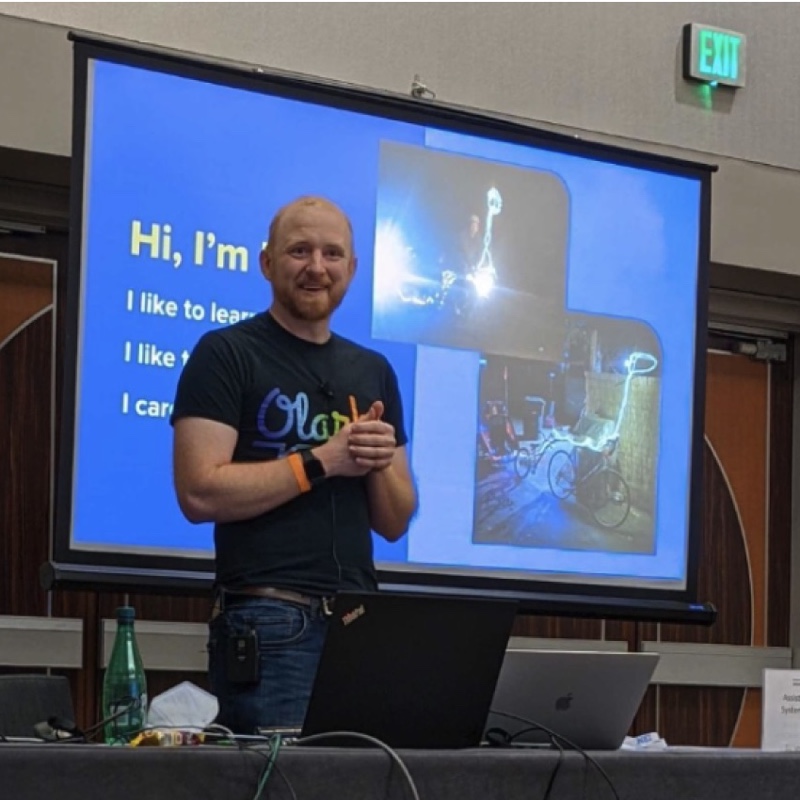Ben Congleton, CEO of Olark standing in front of a room presenting his 2022 GAAD talk