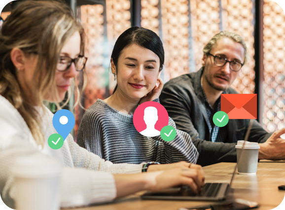 Three person in front of laptop organize customer data